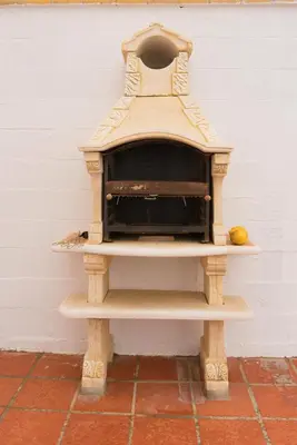a wooden oven sitting next to a wall at El Mirador de Bellavista in Conil de la Frontera