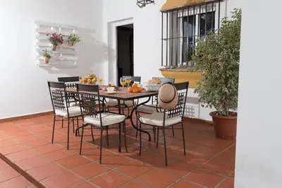 a table and chairs sitting on a patio at El Mirador de Bellavista in Conil de la Frontera