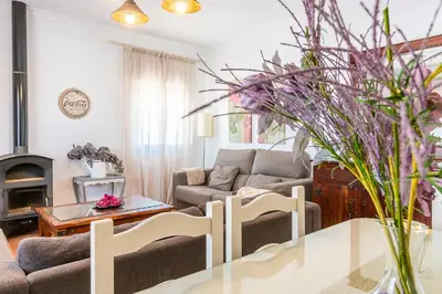 a living room with a couch and a table at El Mirador de Bellavista in Conil de la Frontera