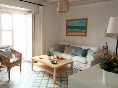 a living room with a couch and a table at Sagasta Apartments in Cádiz