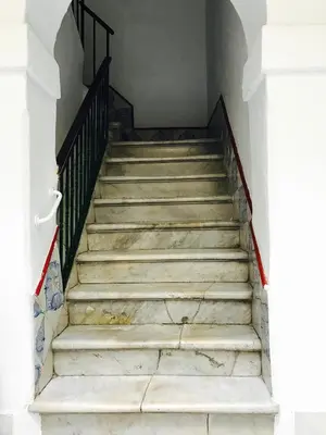 a set of stairs in a building at Ático Falla in Cádiz