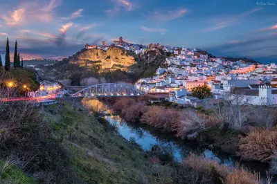 a view of a city with a bridge over a river at Cortijo Bablou in Arcos de la Frontera