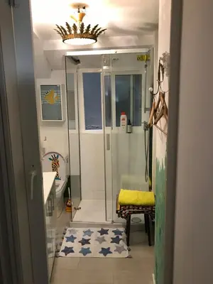 a bathroom with a shower and a sink at Apartamentos La Selva in Cádiz