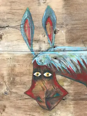 a painting of a chicken with horns on its head at Apartamentos La Selva in Cádiz