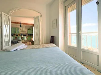 a bedroom with a bed with a view of the ocean at Balcón al Mar con Ascensor Grupo AC Gestion in Cádiz