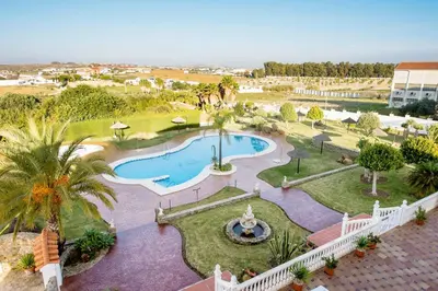 an overhead view of a swimming pool in a resort at Hotel y Apartamentos Diufain in Conil de la Frontera