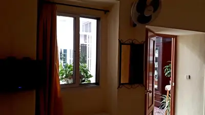 a room with a window and a door at Hostal Manolo in El Puerto de Santa María