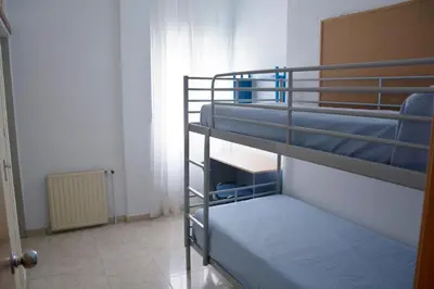 a room with two bunk beds in a room at Residencia Universitaria Cadiz Centro in Cádiz