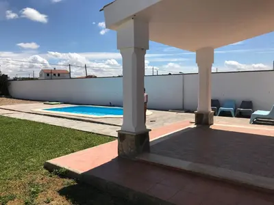 a house with a swimming pool on a roof at Chalet La Primera Piedra in Conil de la Frontera