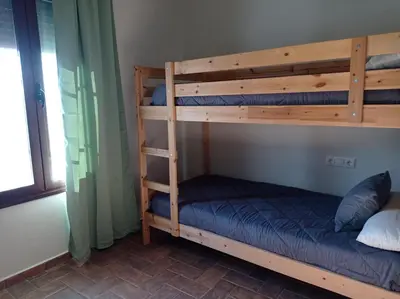 a couple of bunk beds in a room at Chalet La Primera Piedra in Conil de la Frontera
