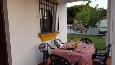 a table with a red and white checkered table cloth at Chalet Roche - Pilahito in Conil de la Frontera