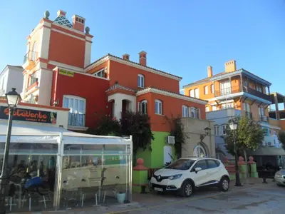 a white car parked in front of a building at estudio marina puerto sherry in El Puerto de Santa María