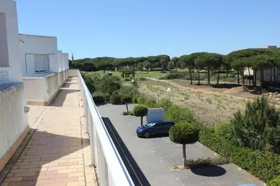 a car parked in a parking lot on a balcony at Apartamento Retama Golf I in Chiclana de la Frontera