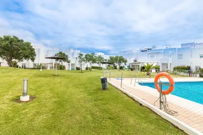 an image of a swimming pool at a resort at Duplex Camino del Tejar in Conil de la Frontera