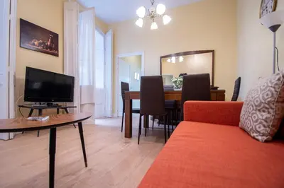a living room with a couch and a table at Apartamento Casa Senorial Cadiz in Cádiz