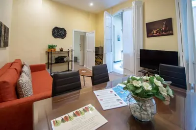a living room with a couch and a table at Apartamento Casa Senorial Cadiz in Cádiz