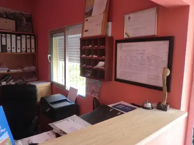 an office with a desk with a window and a desk sidx sidx sidx at Hostal Alhaja Playa in El Puerto de Santa María