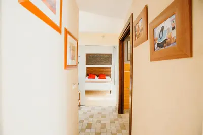 a hallway leading to a bedroom with a bed at Loft del Arte in Cádiz