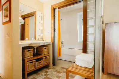 a bathroom with a sink and a bath tub at Loft del Arte in Cádiz