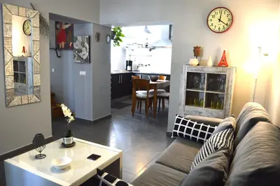 a living room with a couch and a table at Apartamento El Mirador de Cadiz in Cádiz