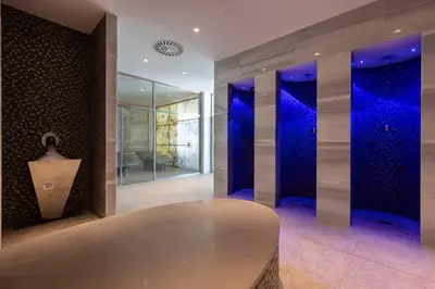 a room with a table and blue lights at Hipotels Barrosa Palace & Spa in Chiclana de la Frontera
