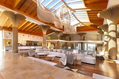 a gym with several treadmills and cardio machines at Hipotels Barrosa Palace & Spa in Chiclana de la Frontera