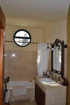 a bathroom with a sink and a bath tub at Villa las Redes in El Puerto de Santa María