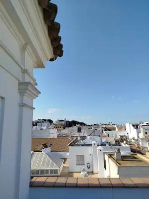 a view of a city from a roof at Apartamentos Fariñas 11 in Sanlúcar de Barrameda