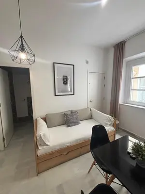a living room with a couch and a table at ISA Cádiz in Cádiz
