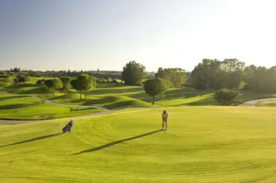 a man standing on a green golf course at Barceló Jerez Montecastillo & Convention Center in Jerez de la Frontera