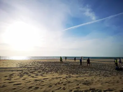 a group of people walking on the beach at VillaLaJaraCom CHALET CON PISCINA, PROHIBIDAS DESPEDIDAS GRUPOS Y FIESTAS, SOLO FAMILIAS RECEPCION POR EL PROPlETARIO in El Puerto de Santa María