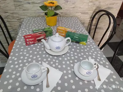 a table with a tea set on top of it at Los Tres Girasoles in Cádiz