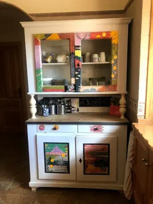 a dresser with a mirror on top of it at HIGOS CHUMBOS, CASA RURAL COMPARTIDO in Chiclana de la Frontera