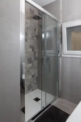 a shower with a glass door in a bathroom at Catedral Cadiz in Cádiz