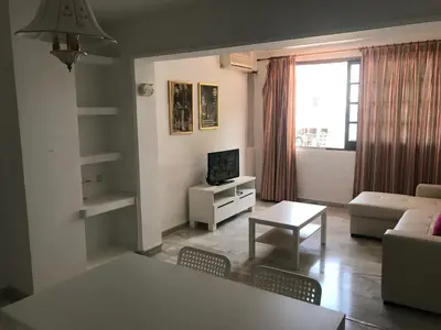 a living room with a couch and a table at Apartamento Vistahermosa Centro in El Puerto de Santa María