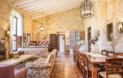 a large living room with a long table and chairs at Jerez Viña Santa Petronila in Jerez de la Frontera