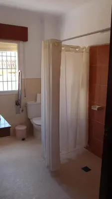 a bathroom with a shower and a toilet at Hotel Catalán Puerto Real in Puerto Real
