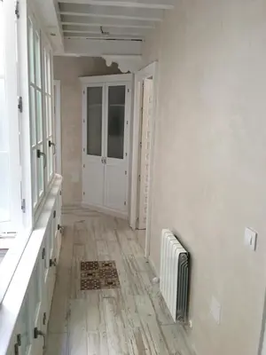 an empty room with a hallway with a door at Casa Bugambilla Cadiz in Cádiz