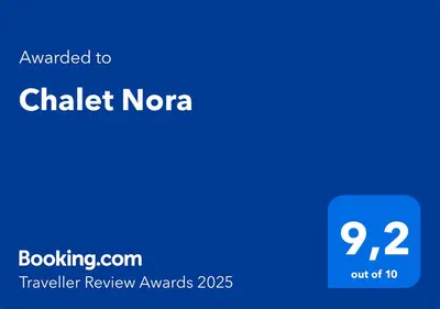 a blue rectangle with the words awarded to chalk norega traveler review awards at Chalet Nora in Chiclana de la Frontera