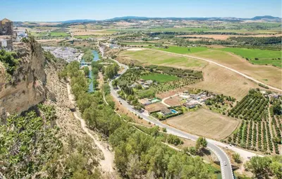 an aerial view of a valley with a road and trees at Beautiful Home In Arcos De La Frontera in Arcos de la Frontera