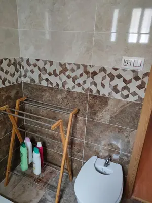 a bathroom with a toilet and a sink at Isabelita in Rota
