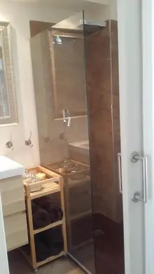 a shower with a glass door in a bathroom at Estudio Deluxe Playa de la Victoria in Cádiz