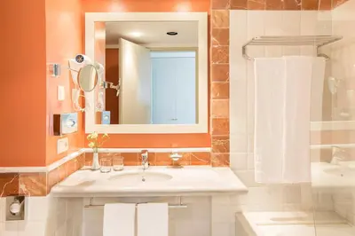 a bathroom with a sink and a mirror at Hipotels Flamenco Conil in Conil de la Frontera
