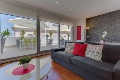 a living room with a couch and a table at El Atico del MARQUES free parking by Cadiz4Rentals in Cádiz