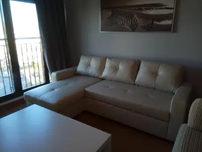 a living room with a couch and a table at Apartamento La Ermita Wifi in Jerez de la Frontera