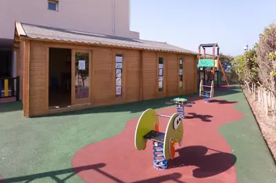 a playground with a skateboard and a slide at Aparthotel las Dunas in Chiclana de la Frontera
