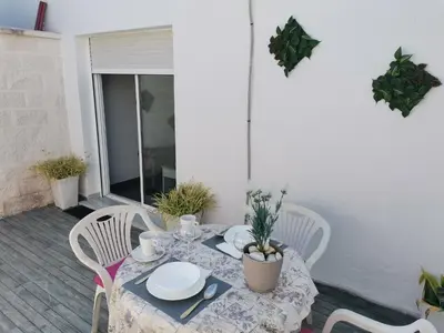 a living room with a couch and a table at Casasjerezanas Loft Las Flores in Jerez de la Frontera