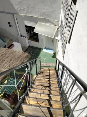 a stairway leading up to a building with a stair case at Rosa de los Vientos in Cádiz