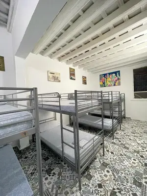 a group of bunk beds in a room at Rosa de los Vientos in Cádiz