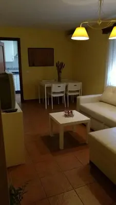 a living room with a couch and a table at Apartamento Cielo 35 in El Puerto de Santa María
